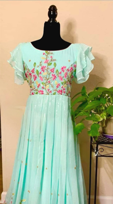 Picture of Blue sequin dress with pink frills