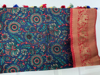 Picture of Dark blue digital print semi banaras saree with contrast red  hand work blouse