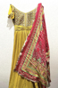 Picture of Mustard color anarkhali dress with beautiful pink dupatta