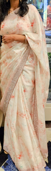 Picture of Beautiful party wear saree with stones studded to the border