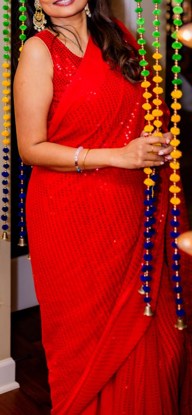 Picture of Beautiful Red  sequins saree with custom stitched sleeveless  blouse