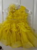 Picture of PL569 Brand new yellow feathers dress by little angels 4-5y