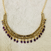 Picture of Victorian purple  kante with matching big earrings.