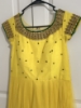 Picture of Yellow netted Long frock