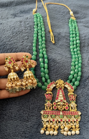 Picture of Jadau kundan lord balaji with original russian onyx emrald 