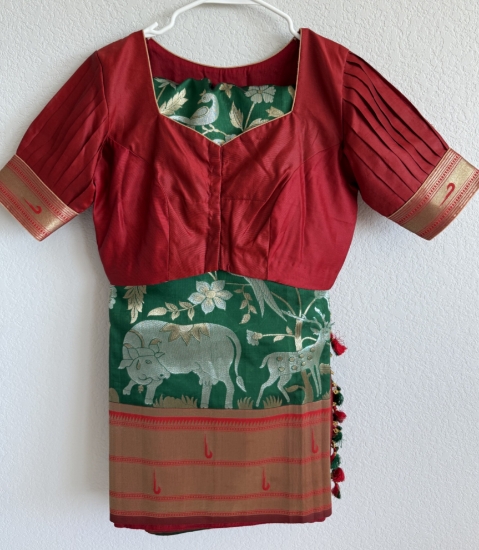 Picture of Paithani half pattu saree in contrast muniya border