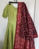 Picture of never worn Parrot Green Anarkali with red patola dupatta