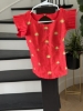 Picture of Ruby red with Olive green lehenga which has red floral motifs