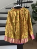 Picture of Ruby red with Olive green lehenga which has red floral motifs