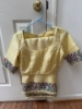 Picture of yellow kota saree with intricate embroidery 